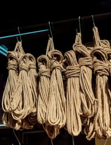 hanks of linen rope hang from hooks